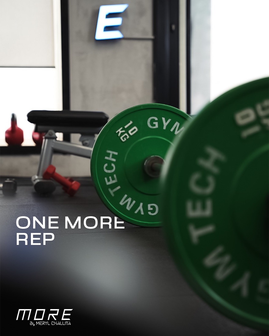 Loaded barbell on the gym floor at MORE