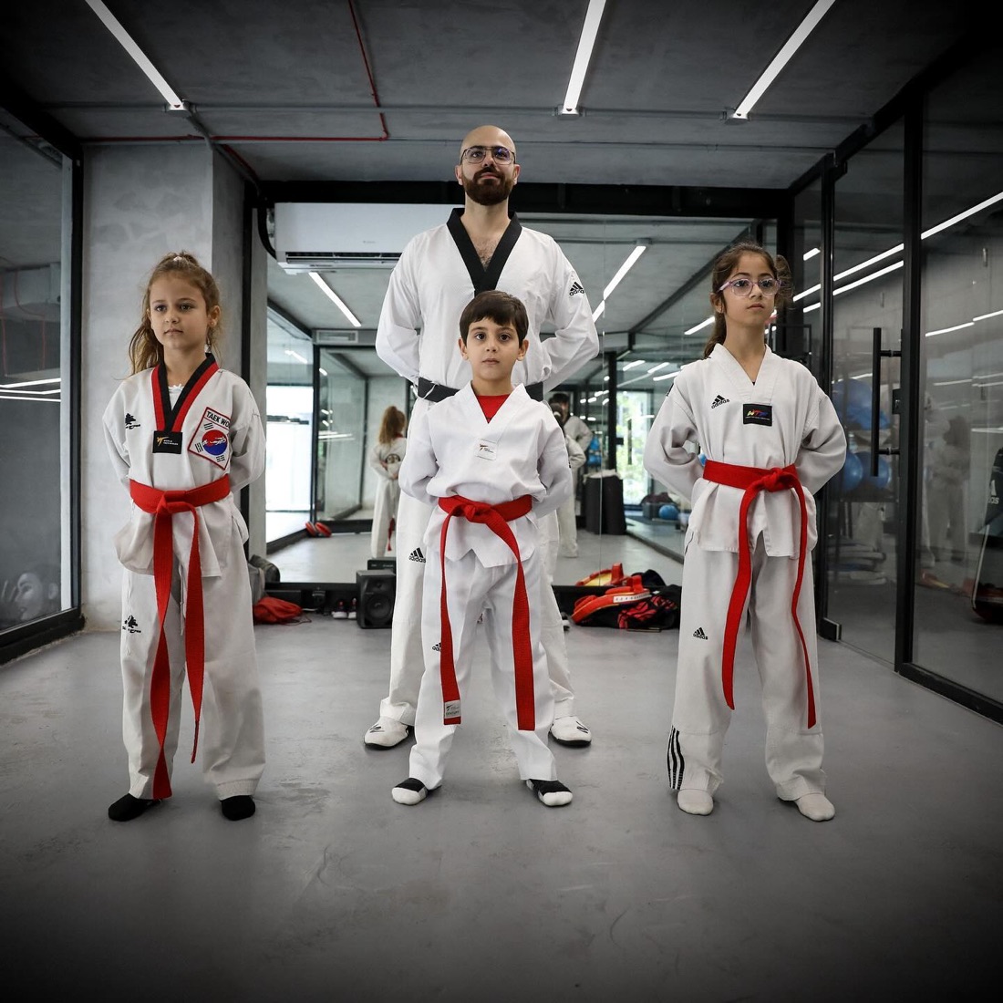 Yorgo with three young students in doboks at MORE