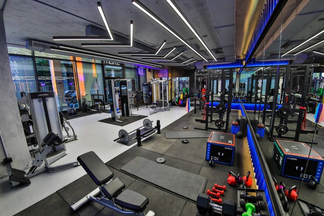 Free weights and rigs across the training floor