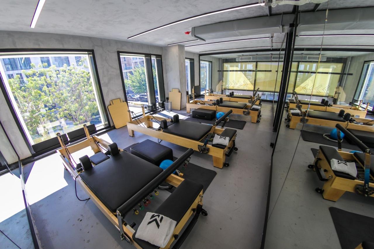 The reformer pilates studio at MORE, looking out over Waterfront City